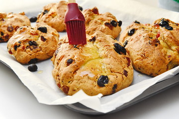 freshly baked buns are covered with sauce