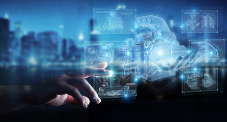 Businessman hand holding and touching wireframe holographic digital projection of an engine 3D rendering