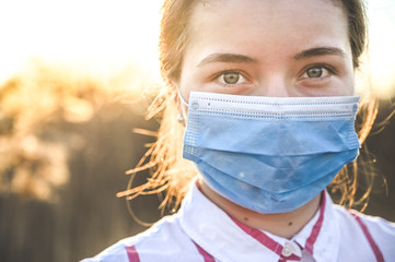Woman wearing protective mask against coronavirus. Put mask to fight against Corona virus. COVID-19...