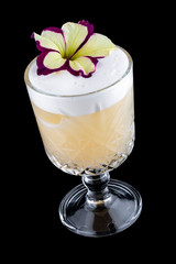 Exquisite cold cocktail with pear and peach on a dark background