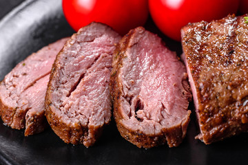 Ribeye steak with potatoes, onions and cherry tomatoes