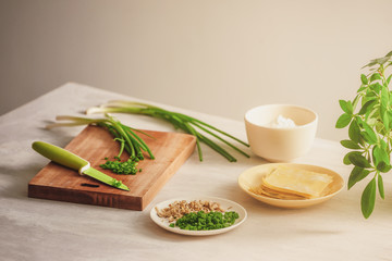 Wrapping Wonton and raw ingredients isolated at kitchen