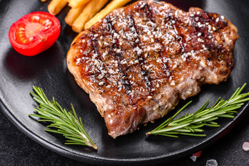 Ribeye steak with potatoes, onions and cherry tomatoes