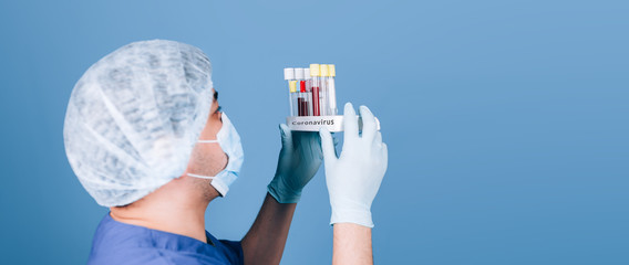 doctor holding test tubes