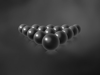 Dark grey billiard balls on a black and grey gradient textured background