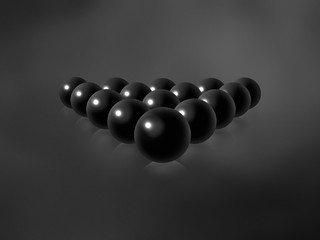 Black billiard balls on a black gradient textured background