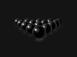 Black billiard balls on a dark gray smooth background