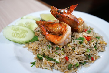 Close up Shrimp fried rice decorated with sliced cucumber