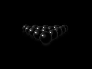 Black billiard balls on a black smooth background