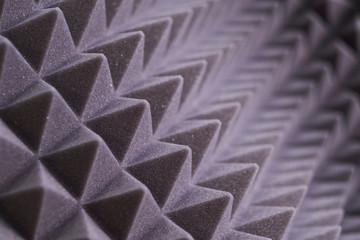 The pattern of the soundproof panel of polyurethane foam. black geometric background