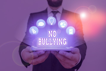 Conceptual hand writing showing No Bullying. Concept meaning stop aggressive behavior among...