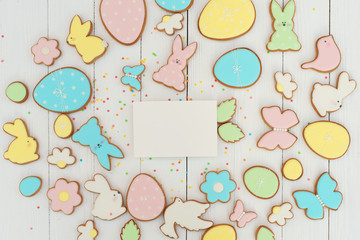 Easter card with gingerbread cookies. Easter card template. Egg shaped cookies and easter bunny.