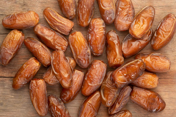 Close up of cluster dates plam. Fresh dates plam on wooden table.
