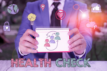 Writing note showing Health Check. Business concept for thorough physical examination A medical...