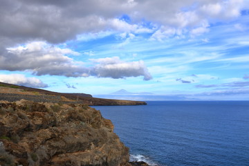 Rocky cliffs on the shore on the coast of La Gomera Island, Canary Islands in Spain