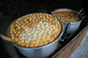 Meatball in fish soup a pot eaten with rice noodles in fish curry sauce with vegetables.