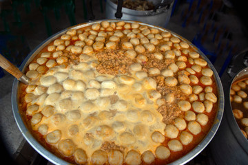 Meatball in fish soup a pot eaten with rice noodles in fish curry sauce with vegetables.