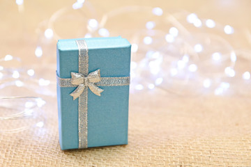 gift box on the background of a garland