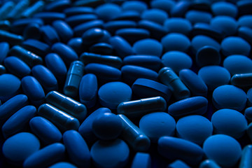 Obraz premium Blue white pills, tablets capsule. Color of the year concept.