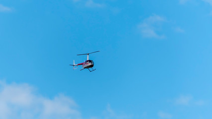 Fototapeta na wymiar Helicopter in the blue sky