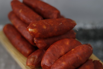 Spicy raw Spainsh sausage on a tray