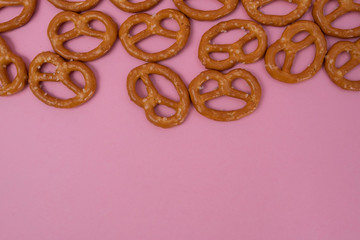Cookies on a pink background. Top view, copy space.