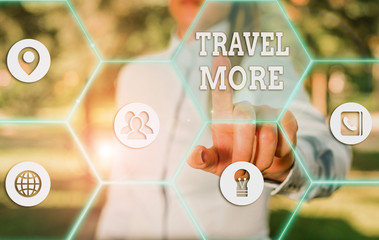 Conceptual hand writing showing Travel More. Concept meaning To make a journey often especially on...