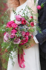 wedding purple boho bouquet in bride's hands