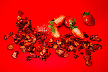Chips from dried strawberries, sliced into thin slices. Background for healthy eating and vegetarianism. Snacks