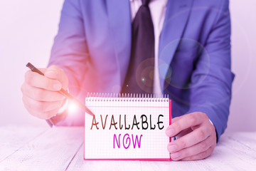Handwriting text writing Available Now. Conceptual photo you can find it obtain or operable at this current moment Man holds empty paper with copy space in front of him Space