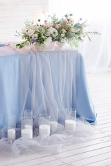 bouquet of flowers in a vase on wedding table