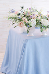bouquet of flowers in a vase on wedding table