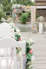 decorated chairs on wedding ceremony