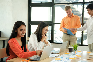 business people discussing on performance revenue in meeting. businessman working with businesswoman.