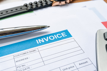 Invoice business document  close up with pen background
