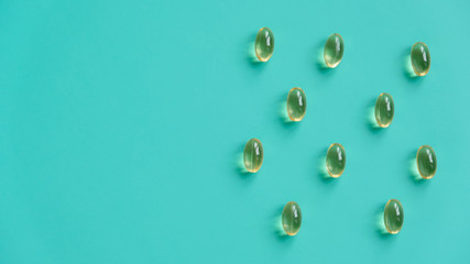 Fish oil capsules on a blue background. Omega-3