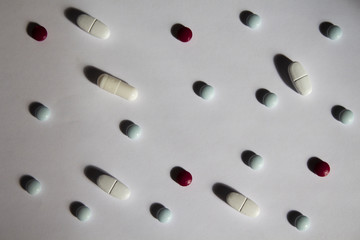 Different pills and drugss on a white background