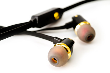 Vacuum headphones in black with a headset, shot on a white background. Background for music and...