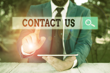 Writing note showing Contact Us. Business concept for Term used to describe reaching out with the...