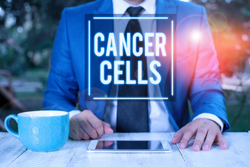 Writing note showing Cancer Cells. Business concept for forming solid tumors or flooding the blood...