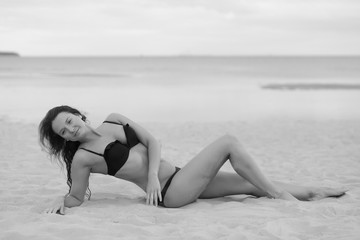 girl in bikini posing on a beach