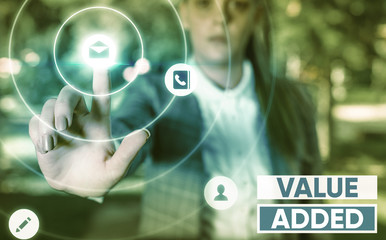 Writing note showing Value Added. Business concept for the extra value created over and above the...
