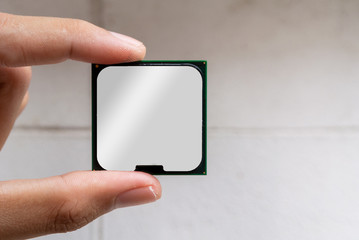 hand holding CPU Chip isolated on white