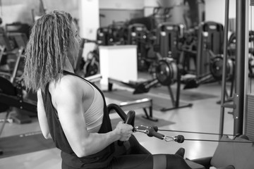 Sexy athletic girl working out in gym.