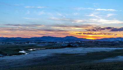 Fototapeta premium Early morning grassland and mountains