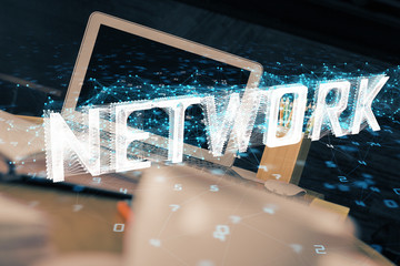 Double exposure of desktop computer and technology theme hologram. Concept of software development.