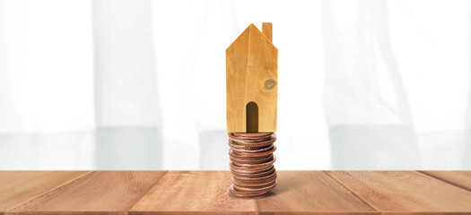 House Model and coins . Housing Real Estate concept. home business idea