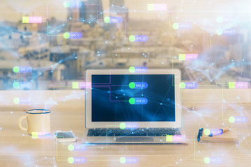 Double exposure of desktop computer and technology theme hologram. Concept of software development.