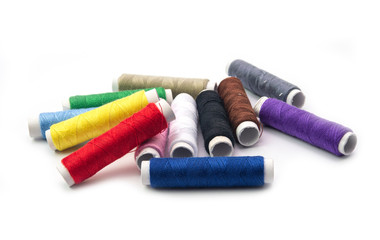 Colorful sewing thread rolls  isolated on white background.Full dept of field. Craft concept.