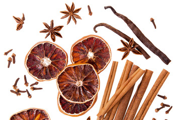 Cinnamon sticks, anise, vanilla and dry orange round slices isolated on white background as Christmas spice set for mulled wine, flat lay